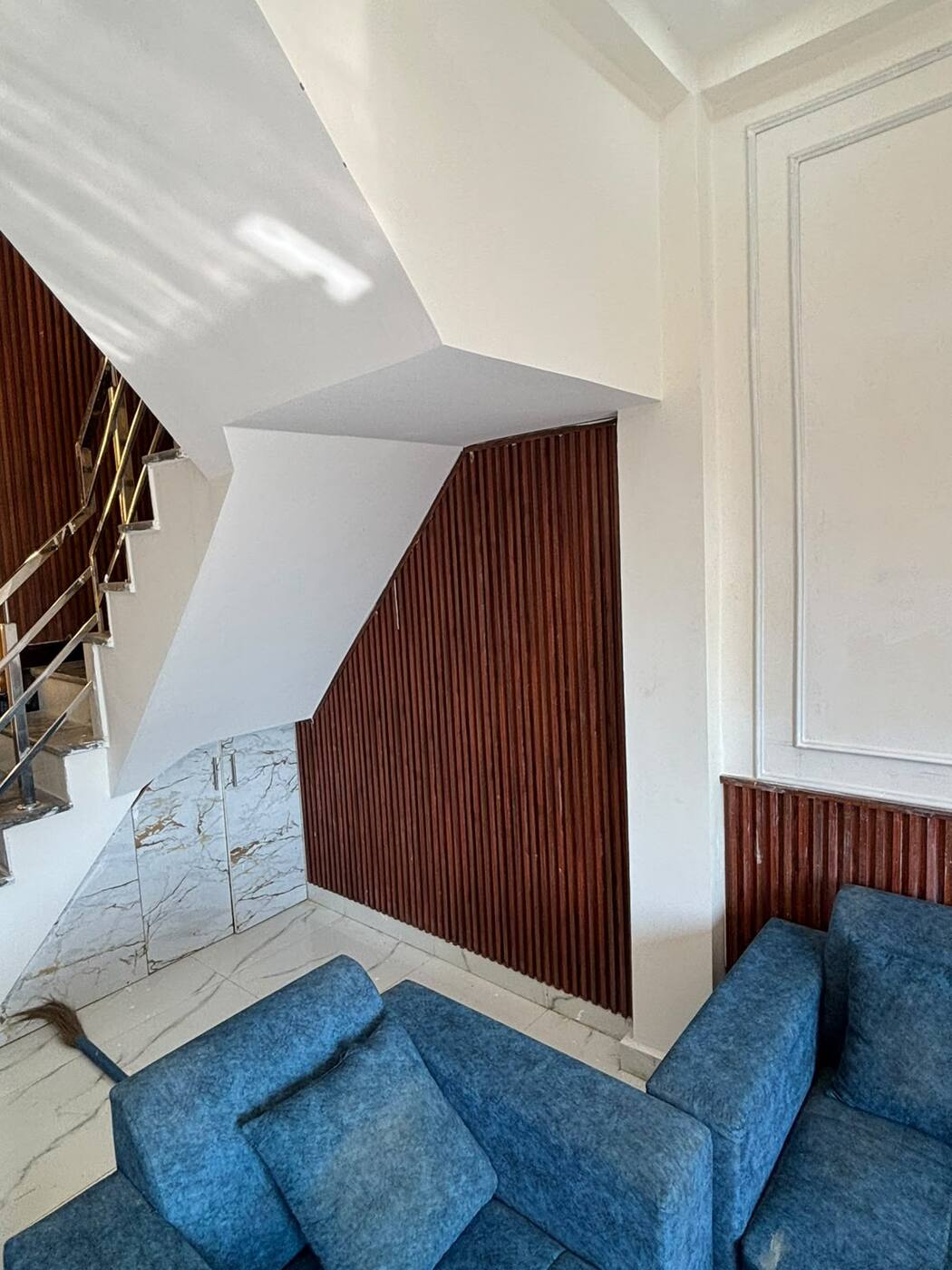 Under-stair storage with marble-finish doors